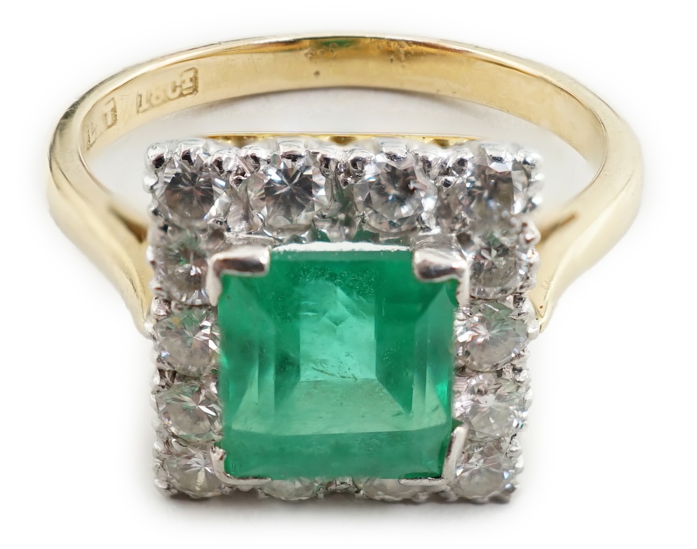 An 18ct gold and platinum, emerald and diamond set square cluster ring